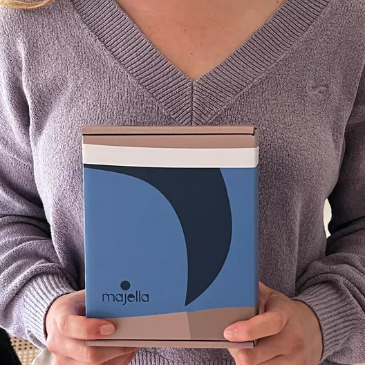 Customer holding a Majella box