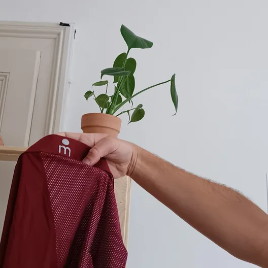 Customer holding burgundy Majella